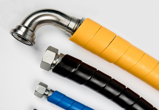 Jak wygląda produkcja osłon spiralnych do węży hydraulicznych ?